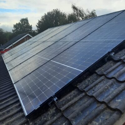 Perfectly placed Solar panel install done on a concrete rood type by Impact Services